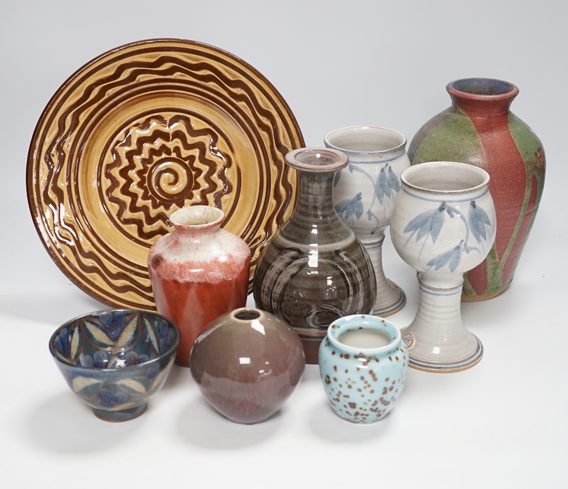 A group of European and Japanese studio pottery dishes, bowls and vases including a Boscastle R Irving plate, largest 26cm in diameter (17)